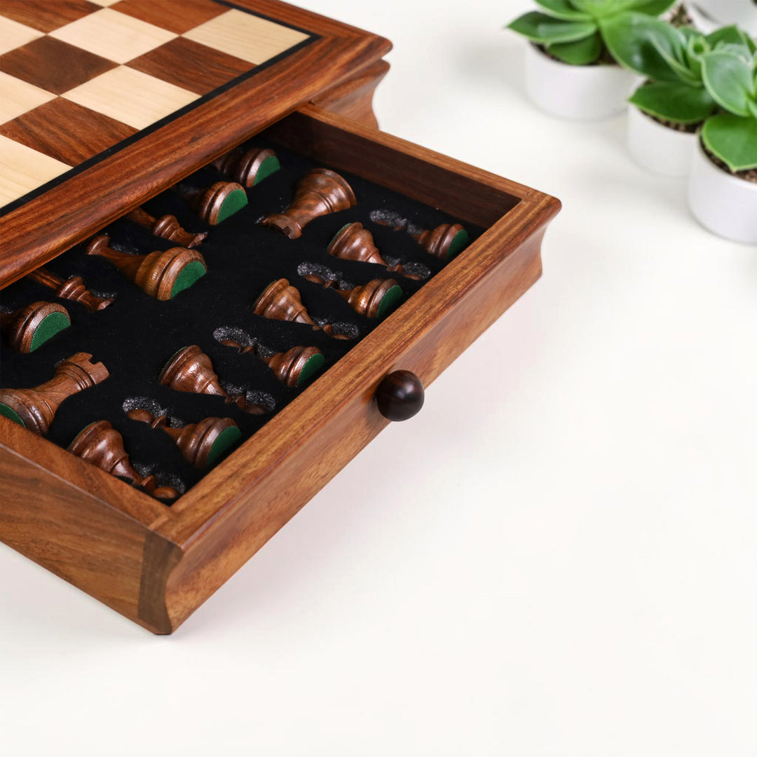 Velvet-lined storage drawer safely holding handcrafted wooden chess pieces.