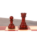Triple weighted bud rosewood pawn and rook luxury chess pieces displayed on the board.