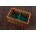 Interior view of wooden storage box with green felt