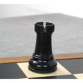 A single black ebonised boxwood rook piece from the 4-inch Leningrad Staunton chess set.