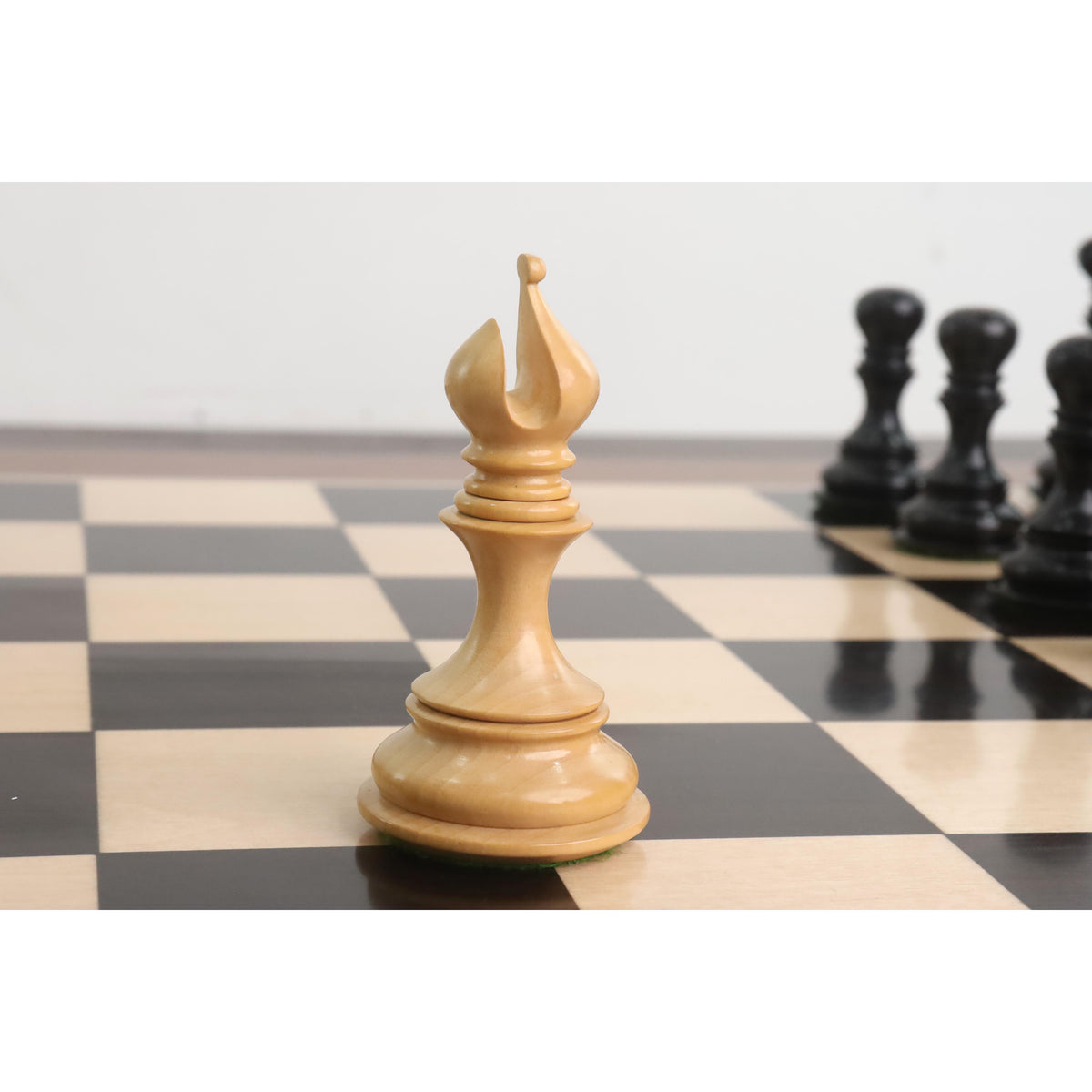 Ornate hand-turned boxwood bishop piece from the Goliath Series luxury Staunton set.