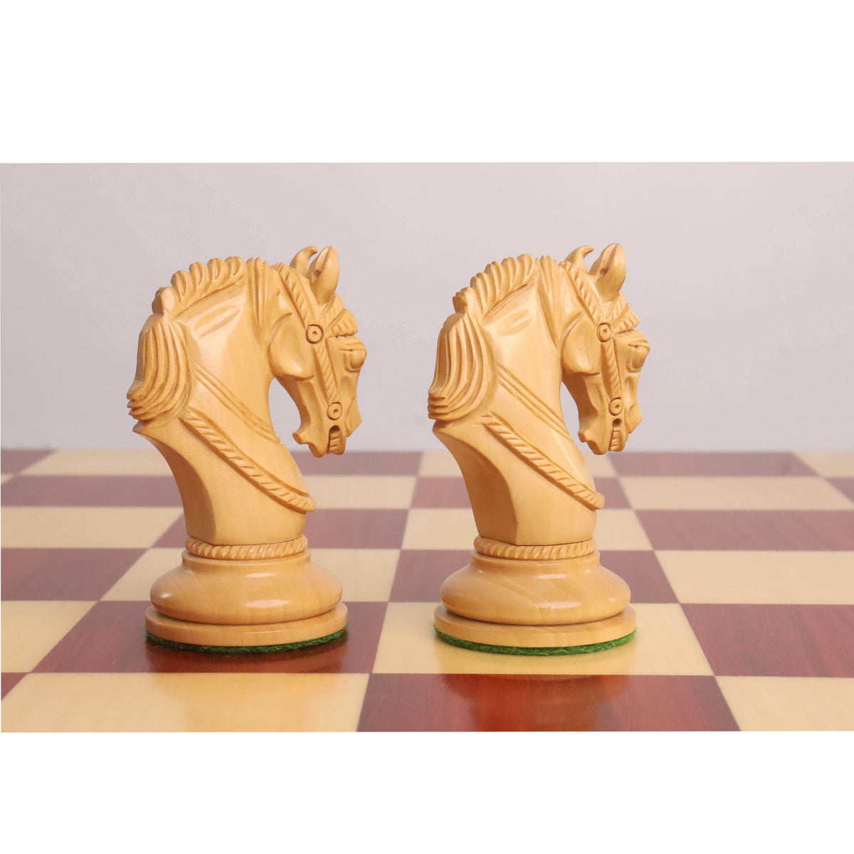 Two hand-carved boxwood knights from the Imperator Staunton set.