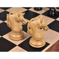 Two intricately carved boxwood knight chess pieces from the Prestige Luxury Staunton set.