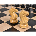Close-up of two intricately carved Fierce Knight Staunton Ebonized Boxwood Knights on a chessboard.