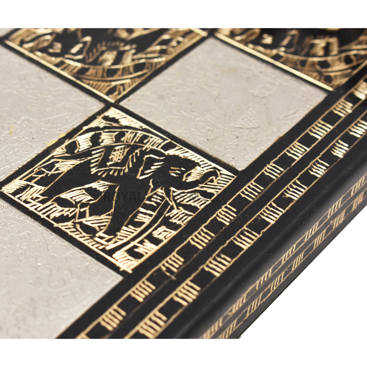 Detailed view of the engraved art squares on the 14-inch luxury chess board.