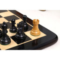 White lacquered boxwood rook piece positioned on a luxury chess board.
