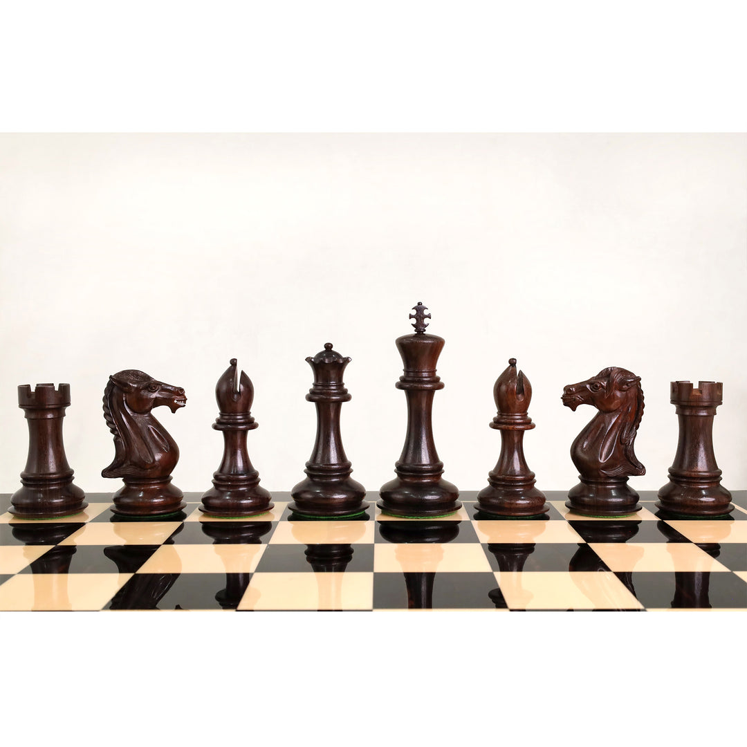 Front view of dark rosewood major chess pieces aligned on the board.