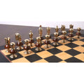 The metallic gold army of the Victorian Fusion brass metal luxury chess set arranged in starting position on a chessboard.