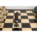 Detailed shot of a metallic grey rook piece from the giant Victorian series brass metal chess set.