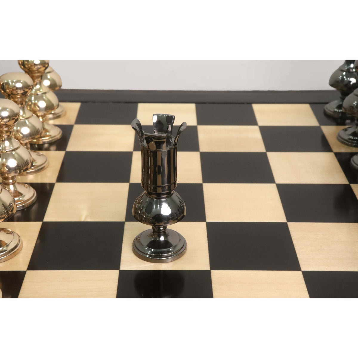Detailed shot of a metallic grey rook piece from the giant Victorian series brass metal chess set.