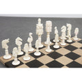 Complete side of animal kingdom chess pieces in natural white camel bone arranged on a checkered board.