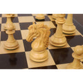 Detailed view of a handcrafted boxwood Heritage Series Staunton knight on a chess board.