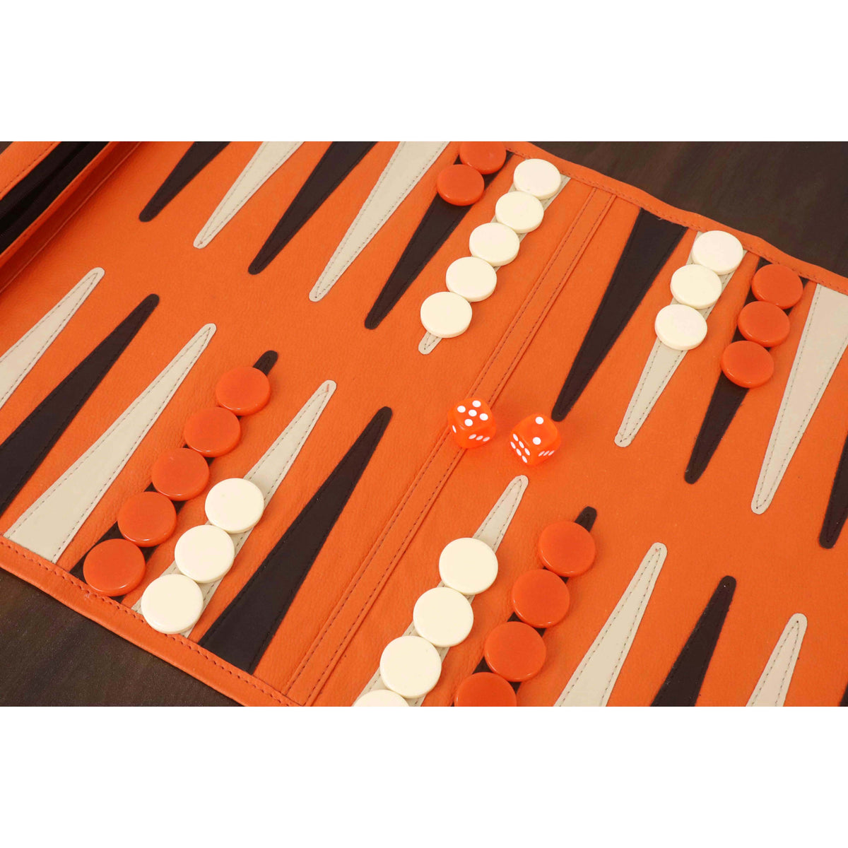 Detailed view of the backgammon board layout and dice during a game.