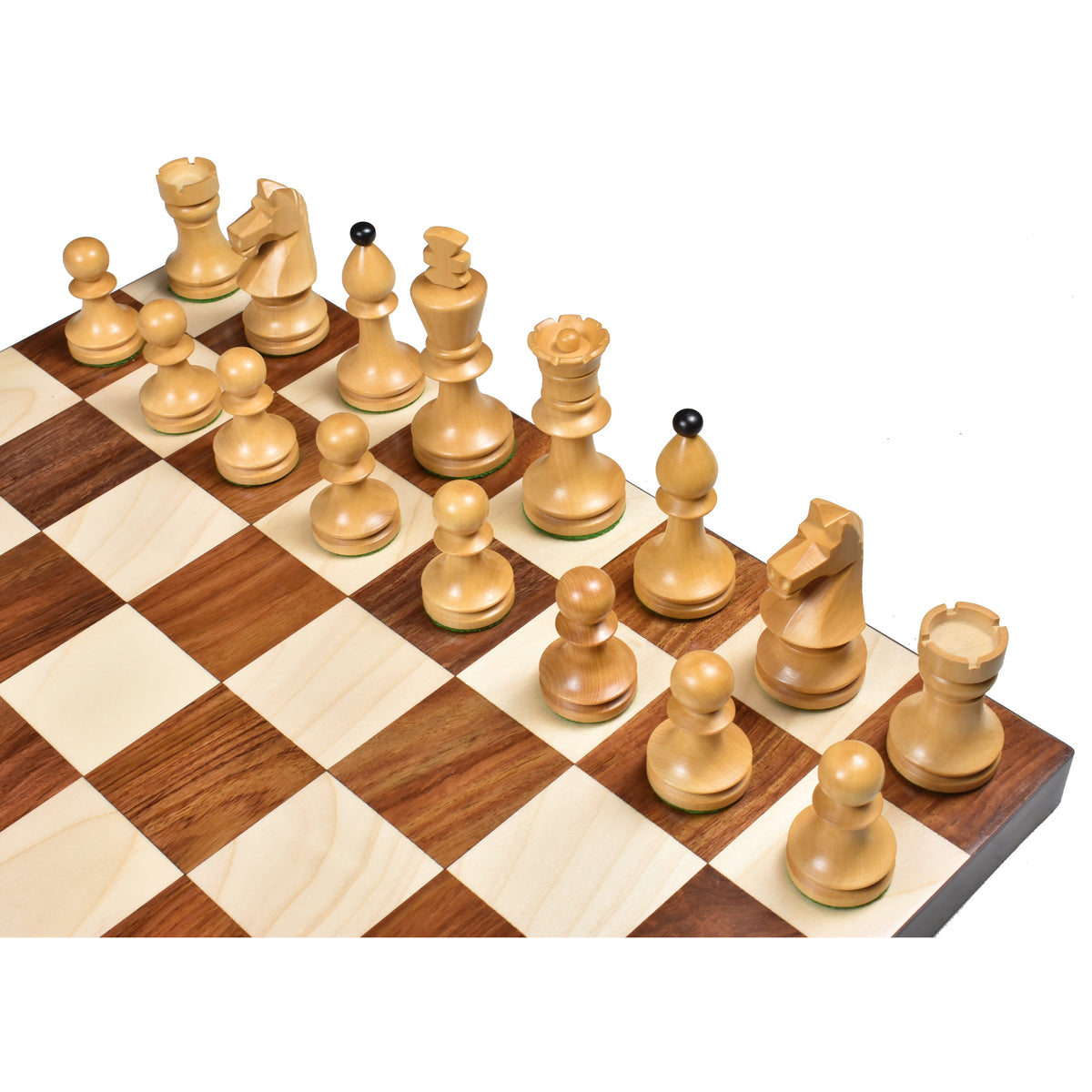 High-angle view of the natural boxwood chess pieces arrayed on a wooden chessboard's starting ranks.