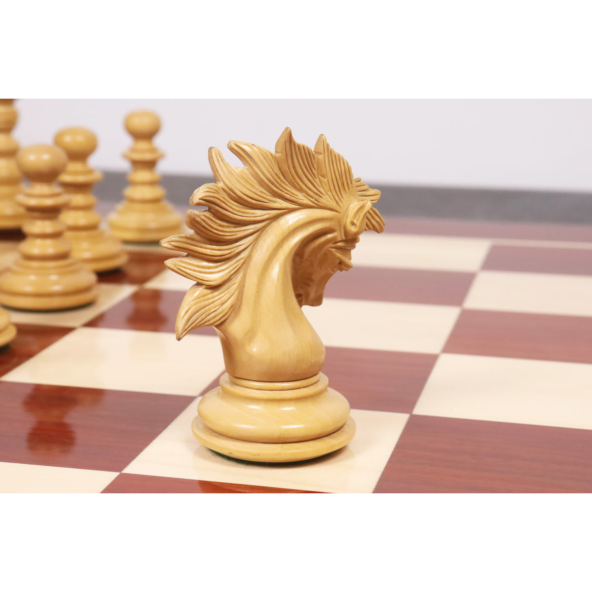 Side profile of the finely crafted Marengo Staunton Knight chess piece on a board.