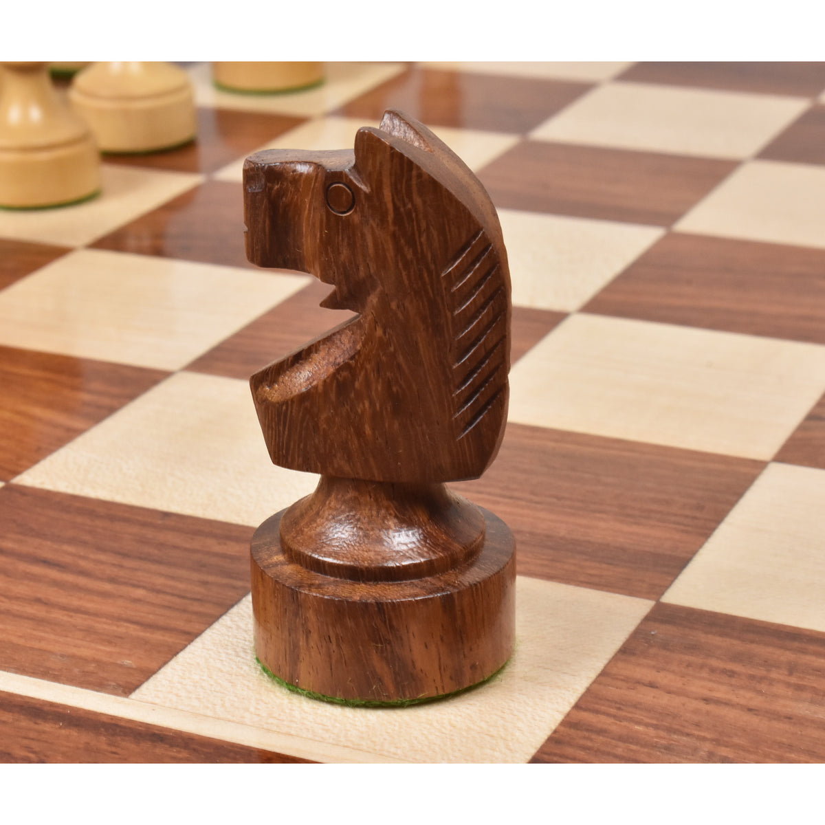 Close-up of a carved dark golden rosewood knight from the Bundesform German Staunton set.