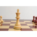 Elegant Boxwood King chess piece from the 1972 Fischer Spassky series on a mahogany board.