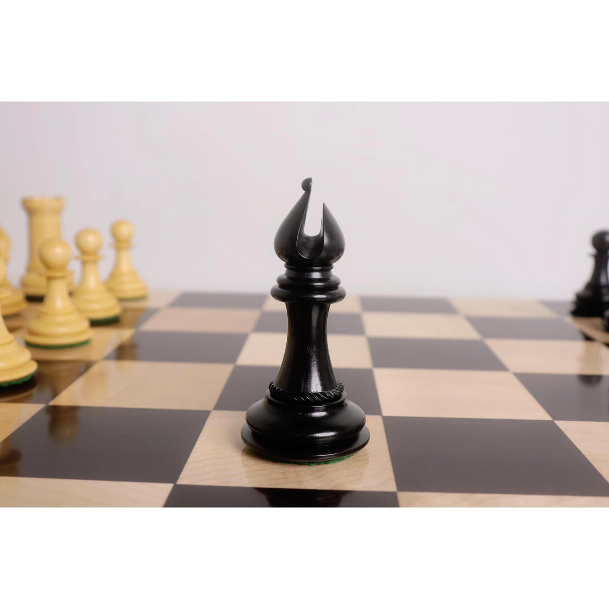 Premium ebony wood Bishop with sleek miter cut from the Incitatus luxury Staunton chess pieces collection.