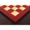 Detailed shot of the decorative border and corner craftsmanship of the Red Ash Burl & Boxwood printed chess board.
