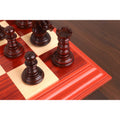 Detailed bud rosewood Staunton rook and pawns on the board.