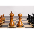 Antiqued Boxwood English Dublin King and pawn standing side-by-side on a chessboard.