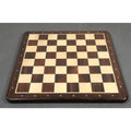 Full-board perspective shot of the 21 inch Rosewood and Maple flat chess board on a grey studio surface.