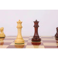 Boxwood and bud rosewood Queens from the 4.5 inch Incitatus luxury Staunton chess set standing on a glossy board.