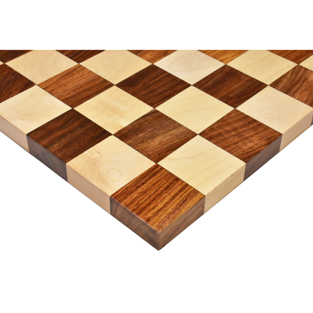 Close-up detailing the corner construction and wood grain of the golden rosewood chess board.