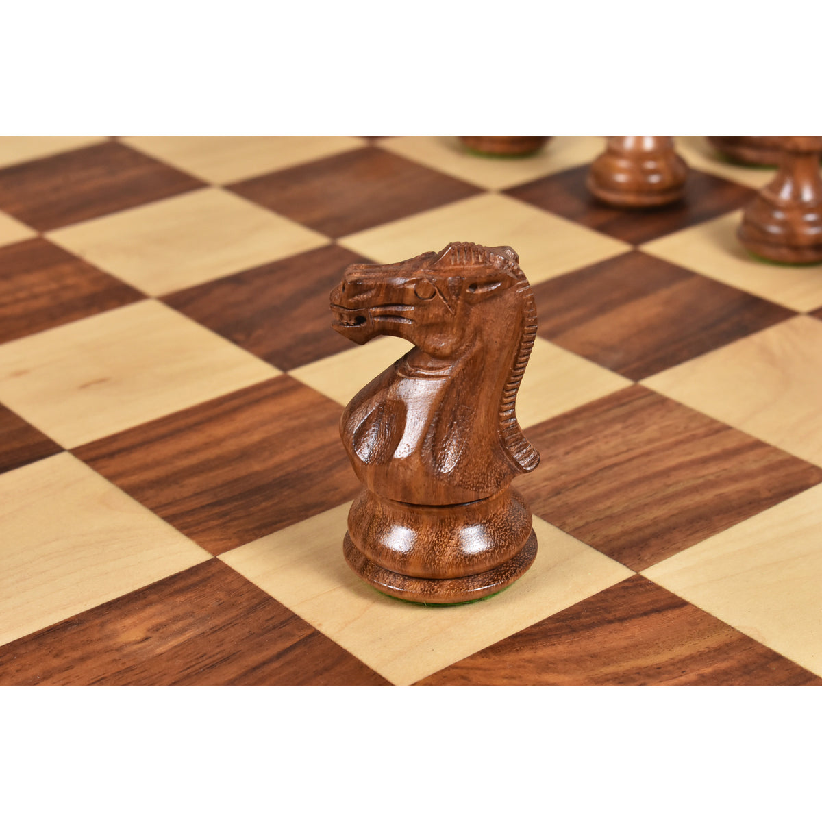 Close-up of the intricately carved Golden Rosewood Staunton Knight.