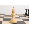 Natural boxwood bishop from the 4" Fierce Knight Staunton chess set resting on a chessboard.