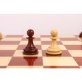White and bud rosewood pawn pieces from the 1849 Jacques Cook Staunton chess set.