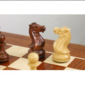 Side-by-side comparison of a dark Golden Rosewood knight and a light Boxwood knight on the chessboard.