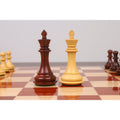 Close-up of a single Boxwood bishop from the Spiraled Steed luxury chess set on a board.