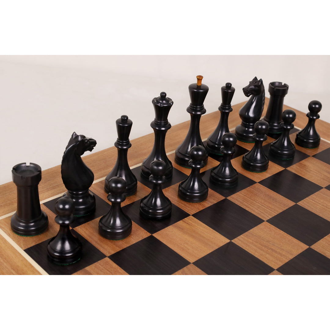 Black Botvinnik Flohr II chess pieces arranged on a handcrafted ebony and acacia wood chessboard.