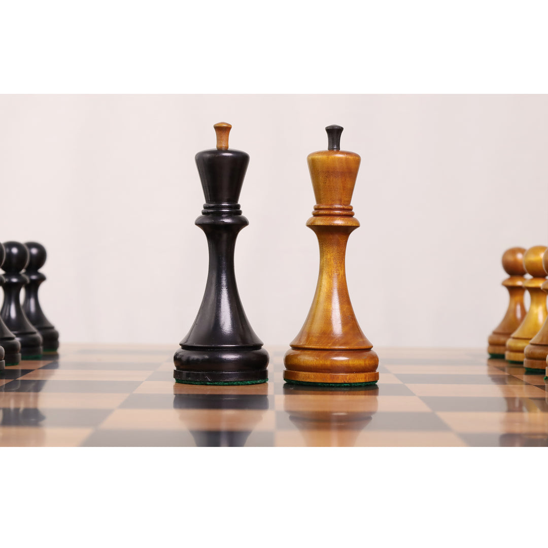Close-up comparison of the light and black Botvinnik Flohr II kings on a wooden chessboard.