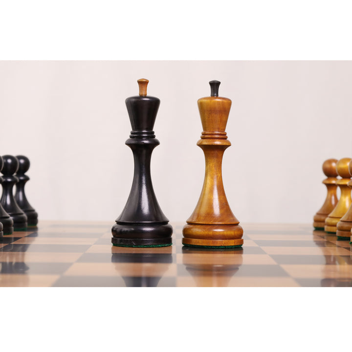 Close-up comparison of the light and black Botvinnik Flohr II kings on a wooden chessboard.