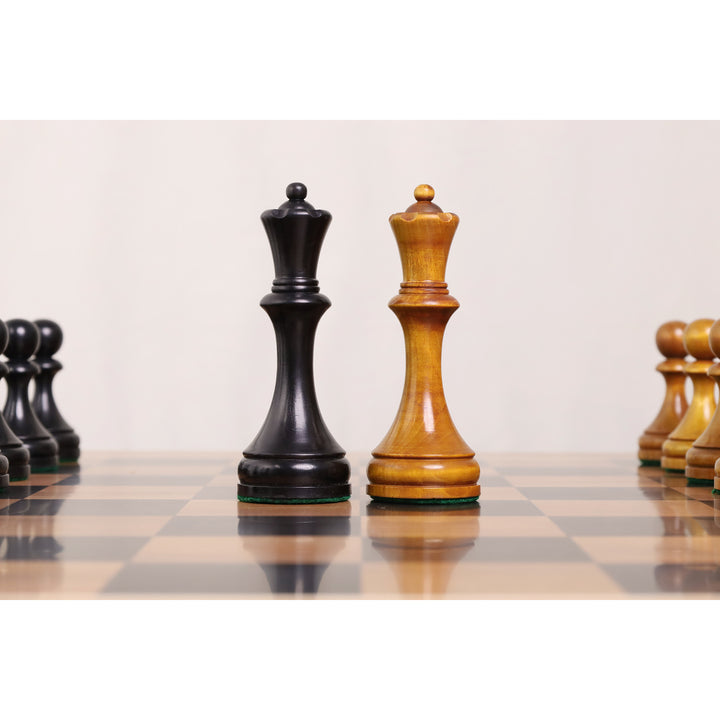 Close-up comparison of the light and black Botvinnik Flohr II queens highlighting the classic Soviet design.