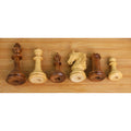 Underside view of weighted Golden Rosewood and Boxwood chess pieces showing base detail.