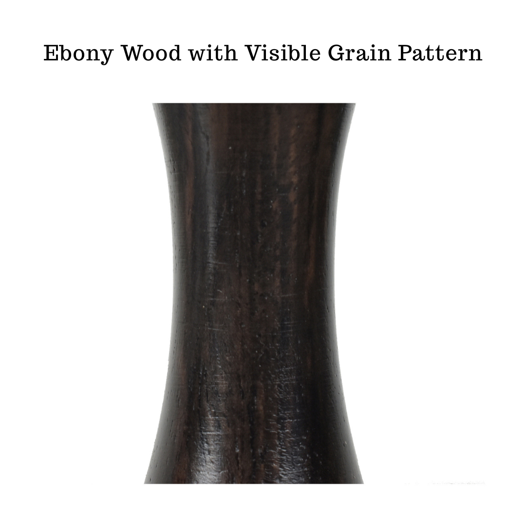 Macro detail showing the distinct natural grain pattern of genuine Ebony wood used in the Lessing Staunton chess pieces.