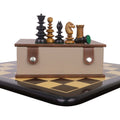 St. John Pre-Staunton Calvert chess pieces on a wooden storage box and board.