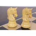 Close-up profile of two intricately carved boxwood Imperial Staunton Knights.