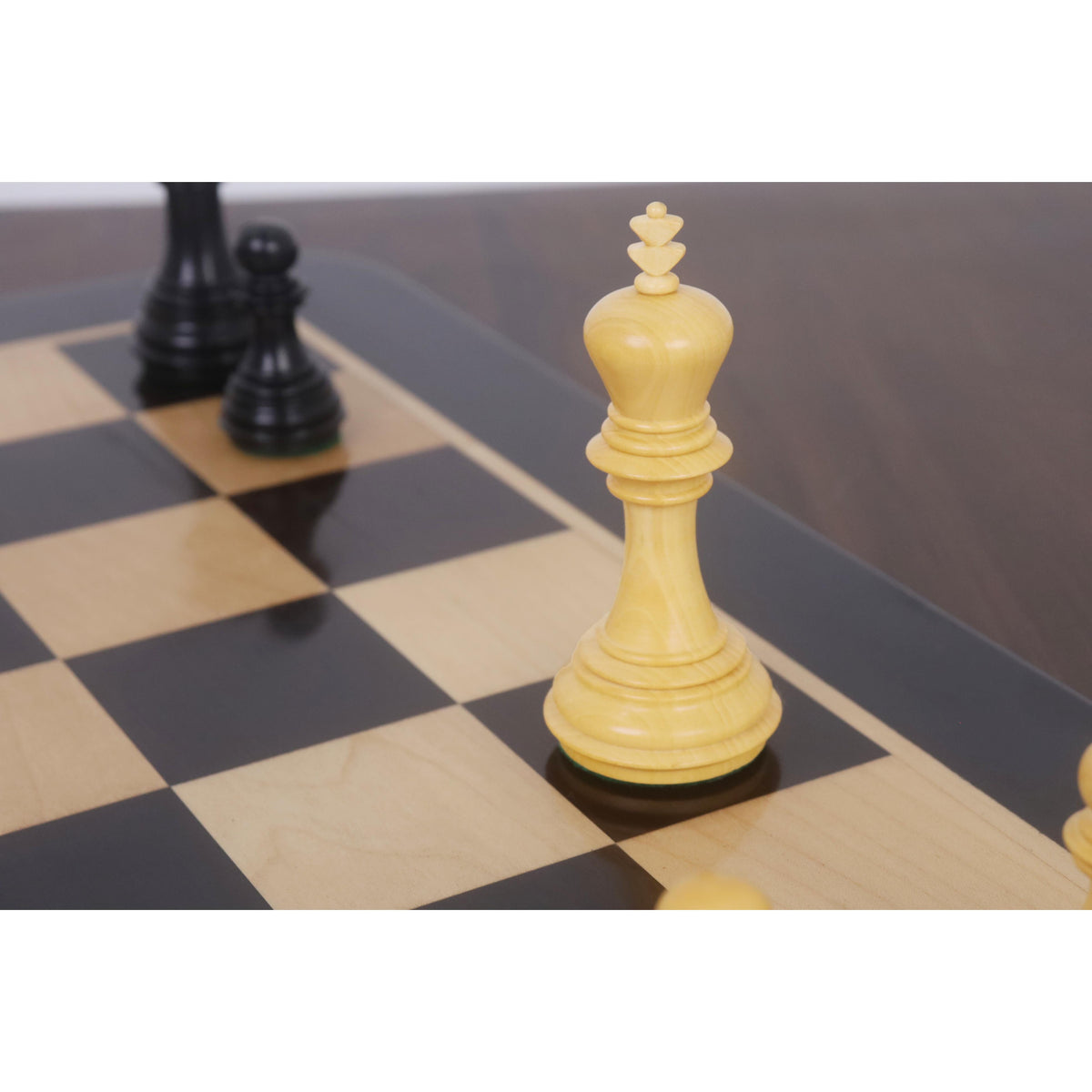 3.8" Imperial Staunton white King piece standing on an ebony and maple chess board.