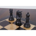 Imperial Staunton black ebony Rook, Knight, and Bishop pieces on a chess board.