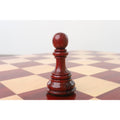 Dark Bud Rosewood Staunton pawn on a wooden chessboard.