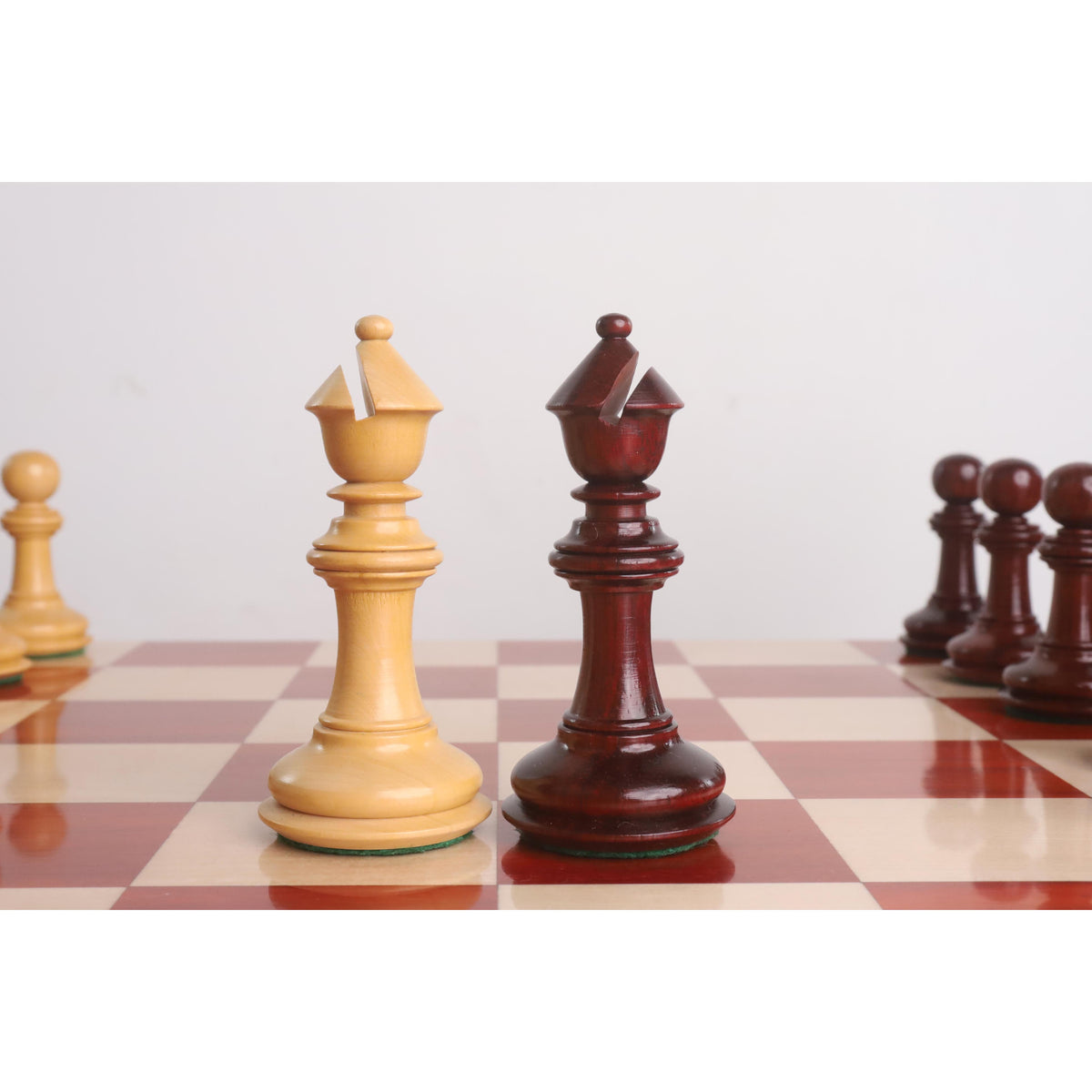 Light and dark Bud Rosewood bishops of the 4.6" Bath Luxury Staunton chess set side-by-side.
