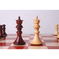 Elegant Bud Rosewood and Boxwood Staunton queens on a chessboard.