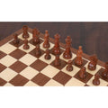 Handcrafted bud rosewood magnetic chess pieces arranged on a wooden chessboard.