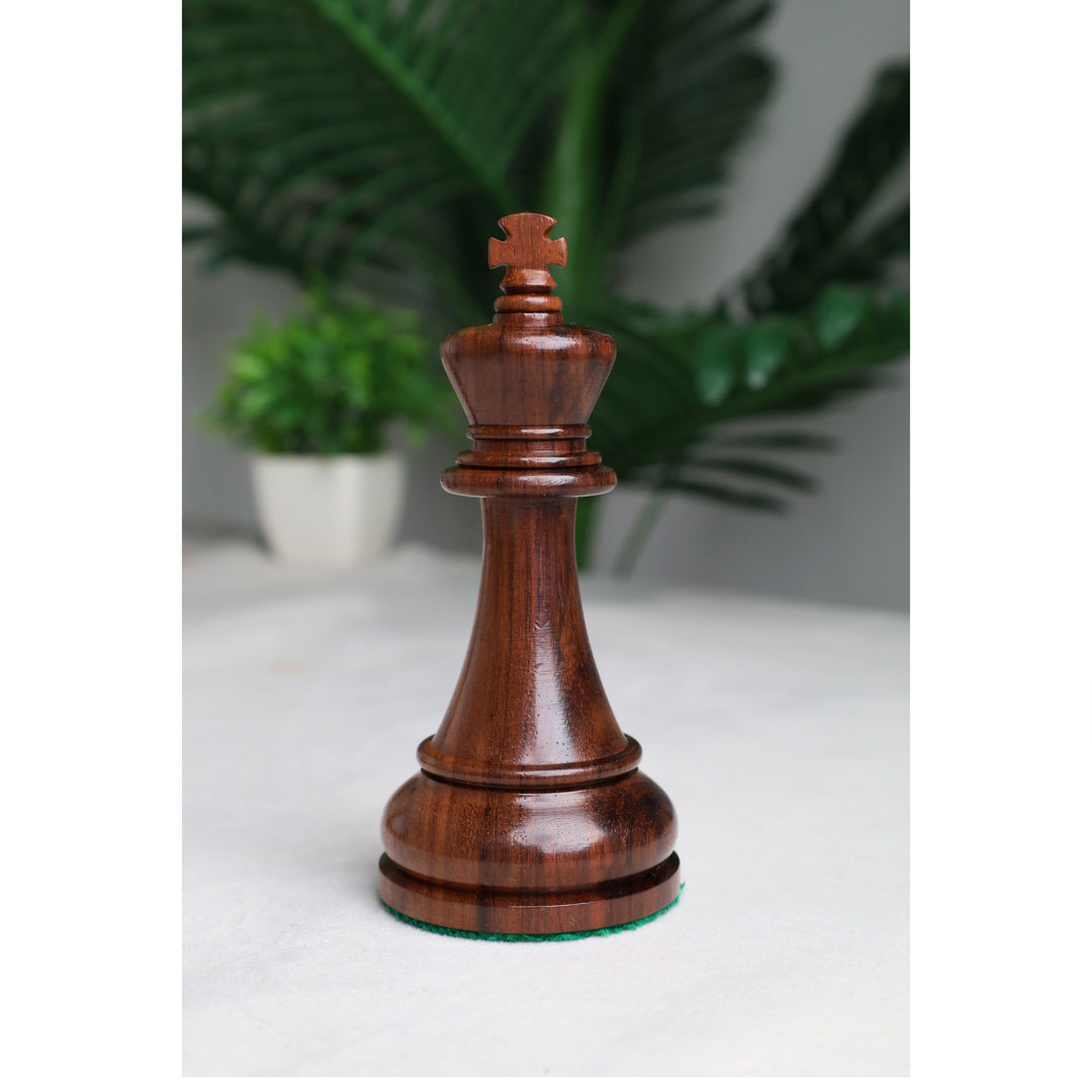 Close-up of the handcrafted rosewood king with a distinctive cross-shaped crown from the Sovereign Crown chess set