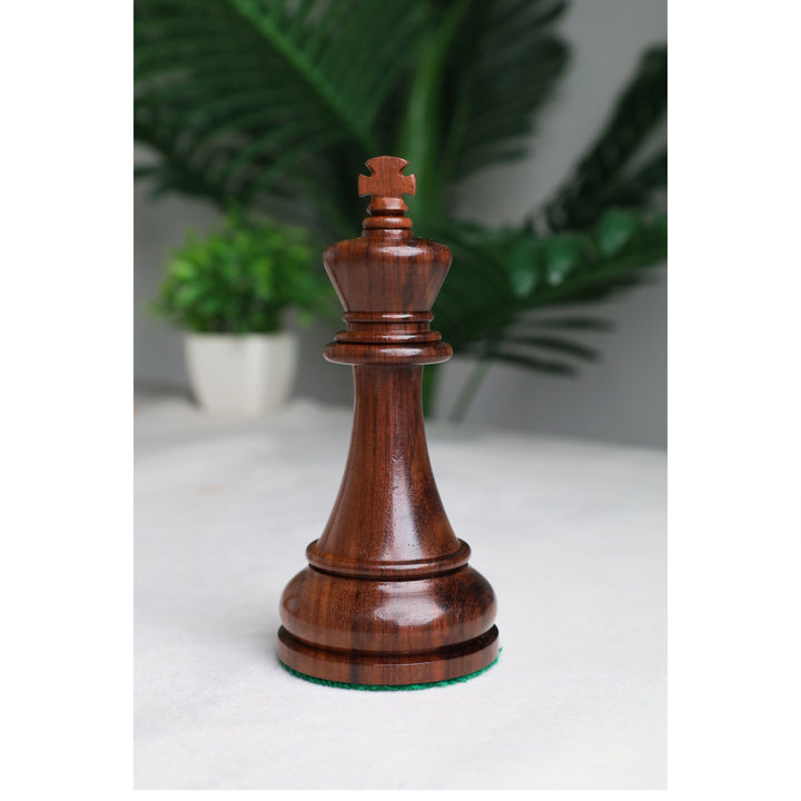 Close-up of the handcrafted rosewood king with a distinctive cross-shaped crown from the Sovereign Crown chess set