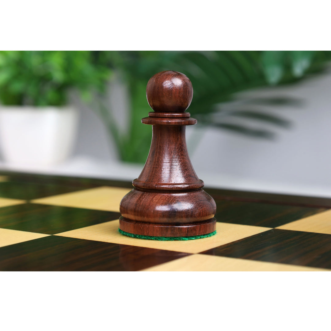 Close-up of a handcrafted rosewood pawn with a rounded head and polished wooden base